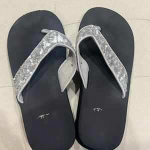 Women’s silver sparkly flip flops